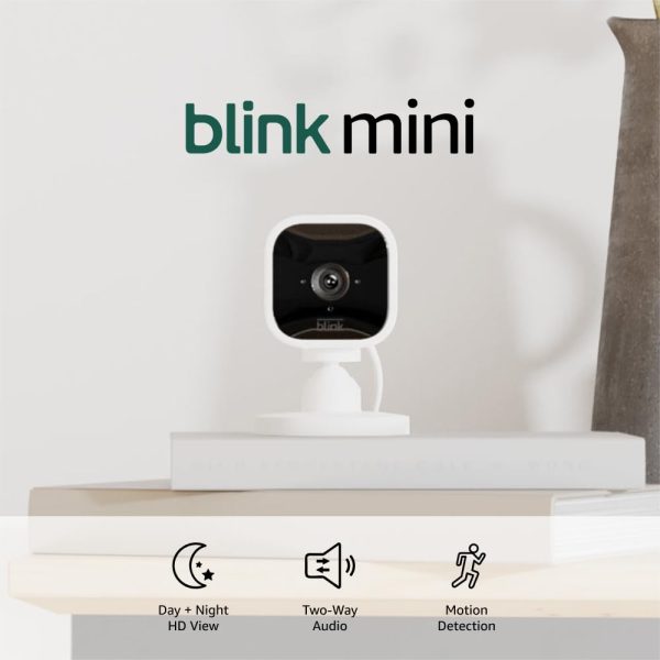 Blink Mini (newest model), Compact indoor plug-in smart security camera, 1080p HD video, night vision, motion detection, two-way audio, easy set up, Works with Alexa – 1 camera (White)